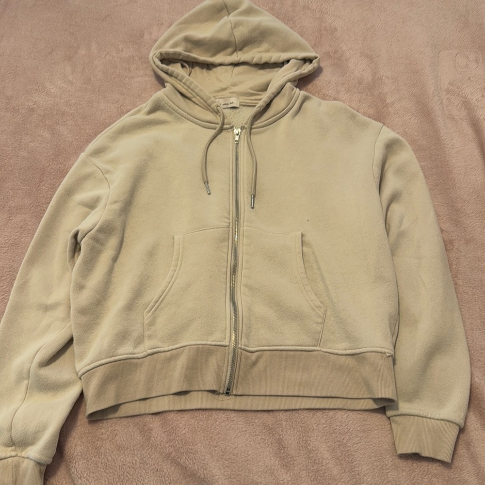 Beige colored zip up hoodie